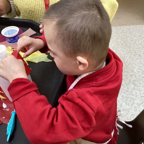 We have made Elmer out of milk cartons! We used our new spring-sprung scissors safely and practised saying our colours whilst we worked!